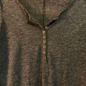 Quarter length navy shirt.